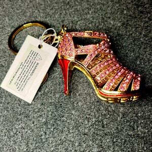 NWT pink crystal with gold and red accent’s bag charm.